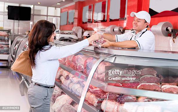 happy customer at the butchers - butcher stock pictures, royalty-free photos & images