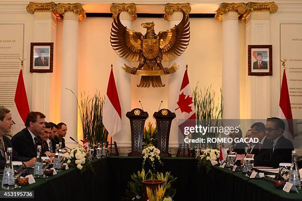 Canadian Foreign Minister John Baird and his Indonesian counterpart Marty Natalegawa meet during their bilateral meeting in Jakarta on August 5, 2014...