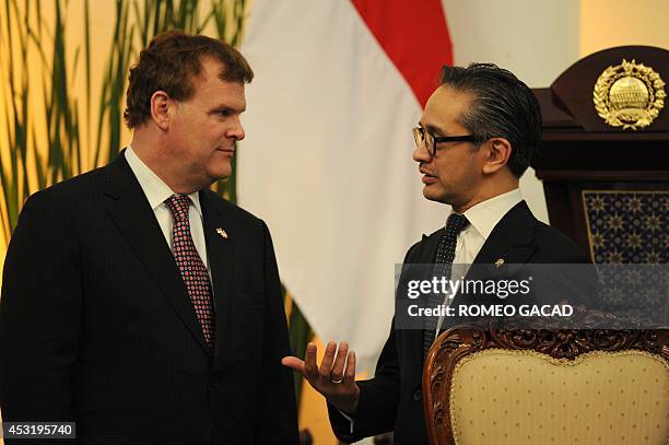 Canadian Foreign Minister John Baird and his Indonesian counterpart Marty Natalegawa meets after their bilateral meeting in Jakarta on August 5, 2014...