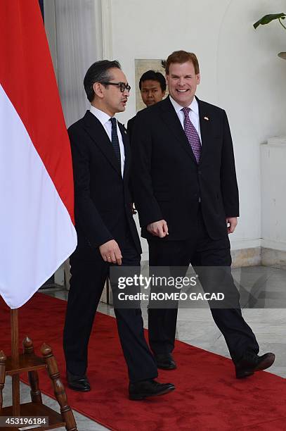 Indonesian Foreign Minister Marty Natalegawa sends off Canadian Foreign Minister John Baird following their bilateral meeting in Jakarta on August 5,...