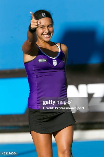 Heather Watson of Great Britain celebrates winning her second round match against Ksenia Pervak of Kazakhstan during day three of the 2013 Australian...