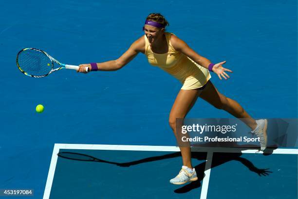 Victoria Azarenka of Belarus plays a forehand in her third round match against Jamie Hampton of the United States during day six of the 2013...