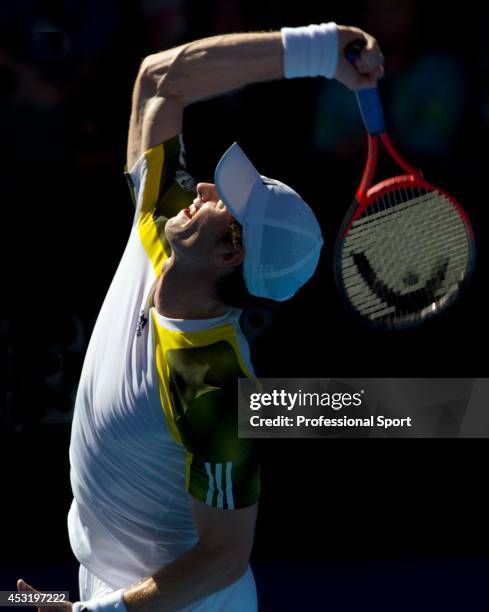 Andy Murray of Great Britain serves in his third round match against Ricardas Berankis of Lithuania during day six of the 2013 Australian Open at...