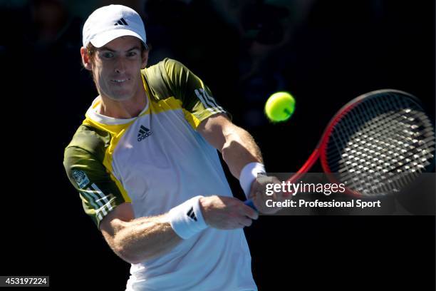 Andy Murray of Great Britain plays a backhand in his third round match against Ricardas Berankis of Lithuania during day six of the 2013 Australian...