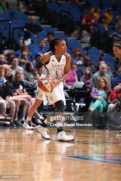 Tan White of the Minnesota Lynx looks to pass the ball against the Tulsa Shock during the WNBA game on July 16, 2014 at Target Center in Minneapolis,...