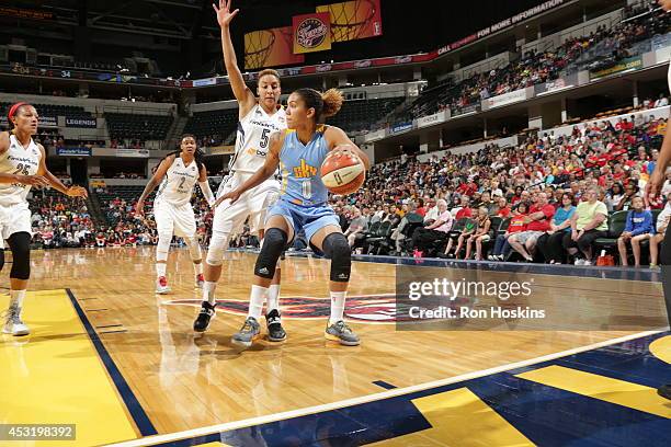 Courtney Clements of the Chicago Sky handles the ball against Layshia Clarendon of the Indiana Fever during the WNBA game on July 17, 2014 at Bankers...