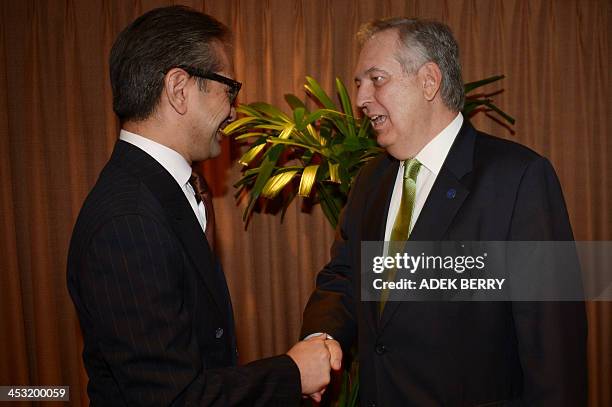 Indonesian Foreign Minister Marty Natalegawa welcomes Brazil's Foreign Minister Luiz Alberto Figueiredo prior to their bilateral meeting on the...
