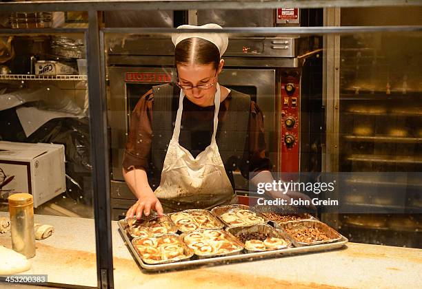 Amish woman making sticky buns at the Reading Terminal Market.