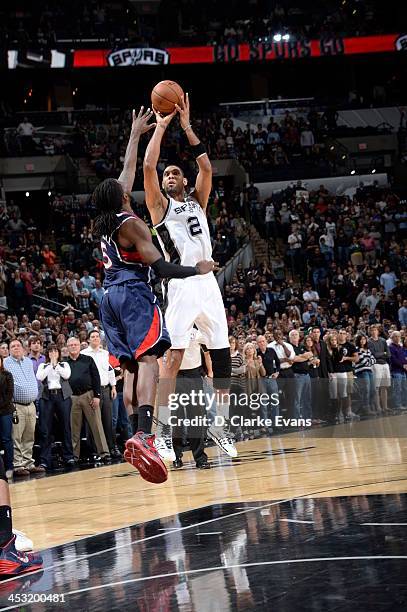 December 2: Tim Duncan of the San Antonio Spurs hits the game winning shot against the Atlanta Hawks during the game at the AT&T Center on December...