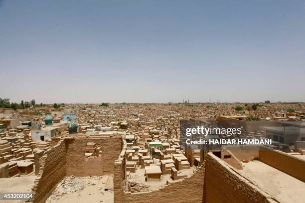 Picture taken on July 14, 2014 shows graves stretching away into the horizon at one of the world's biggest cemeteries in the Iraqi holy Shiite city...