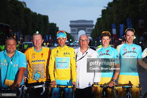 Vincenzo Niabli of Italy poses with his Astana Pro Team after winning the twenty first stage of the 2014 Tour de France, a 138km stage from Evry into...