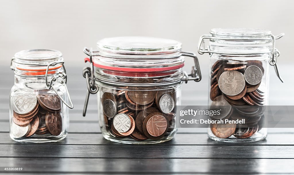 Various jars of money