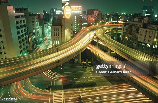 Night view in Nihombashi district in Tokyo. Many elevated highways are built over channels in downtown Tokyo.
