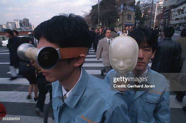 The Tosa brothers. Masamichi Tosa demonstrates the Uo-No-Me, or fish-eye lenses, while his younger brother, Nobumichi Tosa, models the Sava-O,...