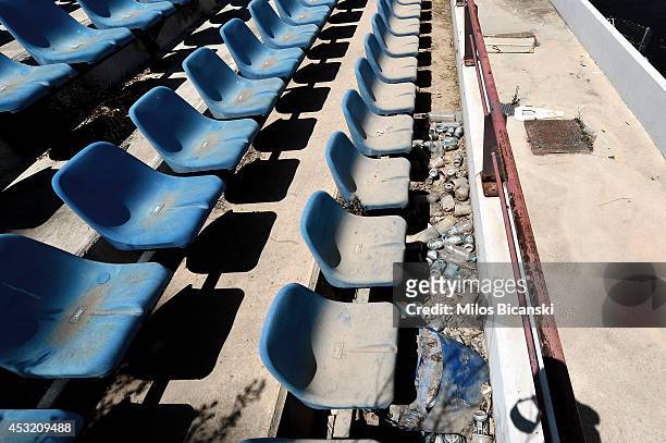 General view of derelict stands at the Olympic Baseball Stadium at the Helliniko Olympic complex in Athens, Greece on July 31, 2014. Ten years ago...