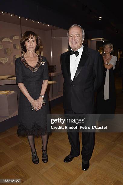 Christian Langlois-Meurinne and his wife attend 'Cartier: Le Style et L'Histoire' Exhibition Private Opening at Le Grand Palais on December 2, 2013...