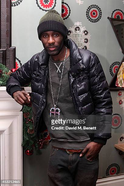 Wretch 32 attends a VIP screening of "Homefront" at the Covent Garden Hotel on December 2, 2013 in London, England.