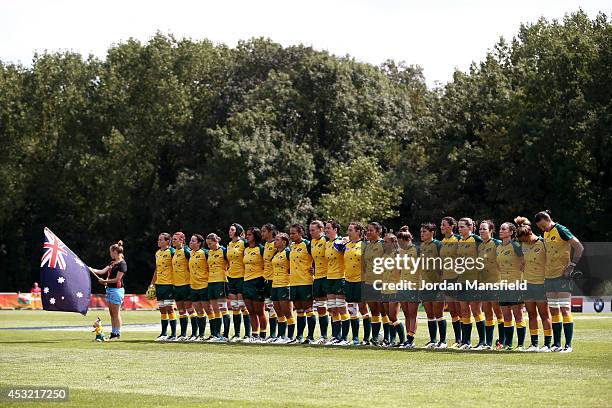 The Australia team line up ahead of their match during the IRB Women's Rugby World Cup Pool C match between Australia and Wales at the French Rugby...