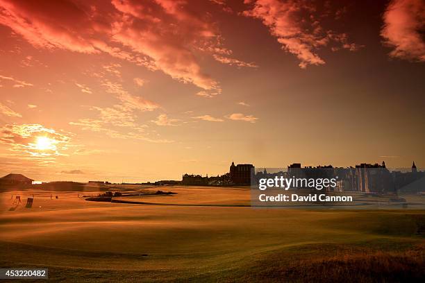 View from behind the green on the par 4, first hole at sunrise on the Old Course at St Andrews venue for The Open Championship in 2015, on July 29,...