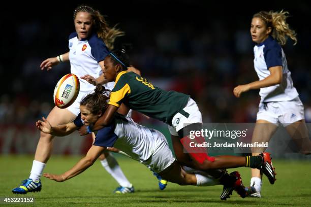 Veroeshka Grain of South Africa tackles Camille Grassineau of France during the IRB Women's Rugby World Cup Pool C match between France and South...