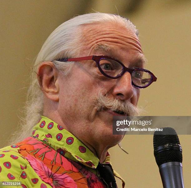 Dr. Patch Adams, founder of the Gesundheit Institute, speaks to students during a conference about laughter therapy at Santo Tomás University on...