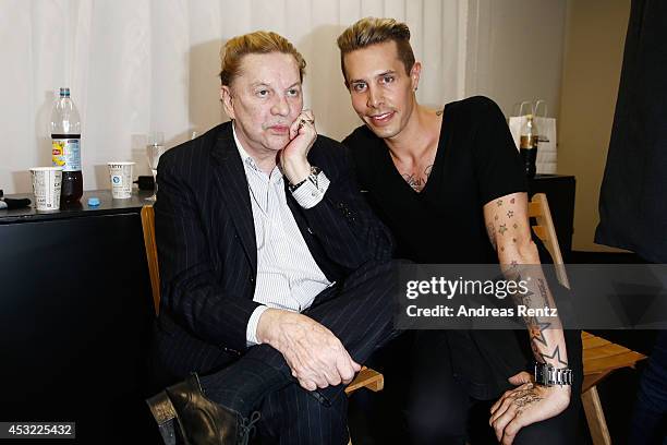 Helmut Berger and designer Florian Wess attends the GarconF fashion show at Balloni-Hallen on August 5, 2014 in Cologne, Germany.