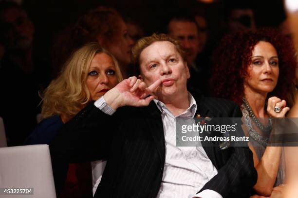 Helmut Berger and Christina aka Mausi Lugner attend the GarconF fashion show at Balloni-Hallen on August 5, 2014 in Cologne, Germany.