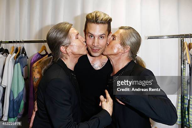 Designer Florian Wess with Arnold and Oskar Wess attend GarconF fashion show at Balloni-Hallen on August 5, 2014 in Cologne, Germany.