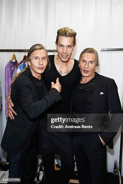 Designer Florian Wess with Arnold and Oskar Wess attend GarconF fashion show at Balloni-Hallen on August 5, 2014 in Cologne, Germany.