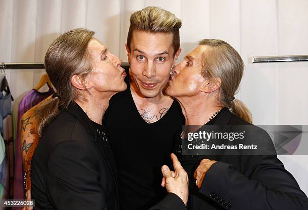 Designer Florian Wess with Arnold and Oskar Wess attend GarconF fashion show at Balloni-Hallen on August 5, 2014 in Cologne, Germany.