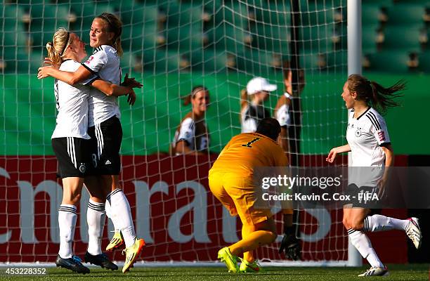 Lena Petermann of the Germany celebrates scoring a goal past goalkeeper Katelyn Rowland of the United States with Pauline Bremer and Theresa Panfil...