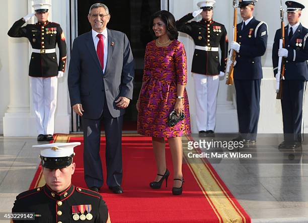 Cabo Verde President Jorge Carlos de Almeida Fonseca and spouse Lígia Arcângela Lubrino Dias Fonseca arrive at the North Portico of the White House...