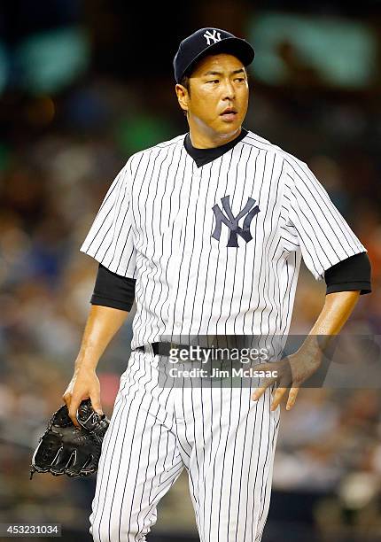 Hiroki Kuroda of the New York Yankees walks to the dugout after the seventh inning against the Detroit Tigers at Yankee Stadium on August 5, 2014 in...
