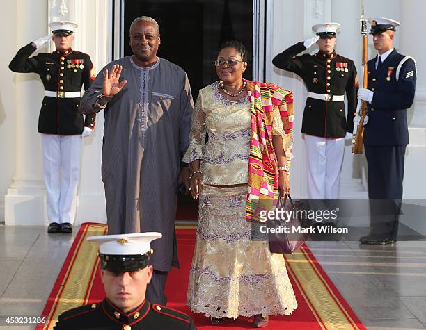 Ghana President John Dramani Mahama and spouse Lordina Dramani Mahama arrive at the North Portico of the White House for a State Dinner on the...