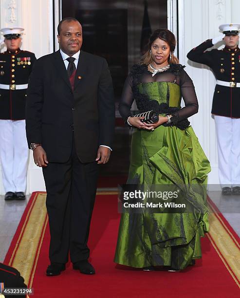 King of Swaziland Mswati III and spouse Inkhosikati La Mbikiza arrive at the North Portico of the White House for a State Dinner on the occasion of...