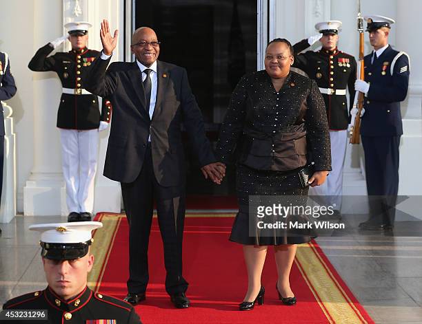 South Africa President Jacob Gedleyihlekisa Zuma and spouse Nompumelelo Primrose Zuma arrive at the North Portico of the White House for a State...