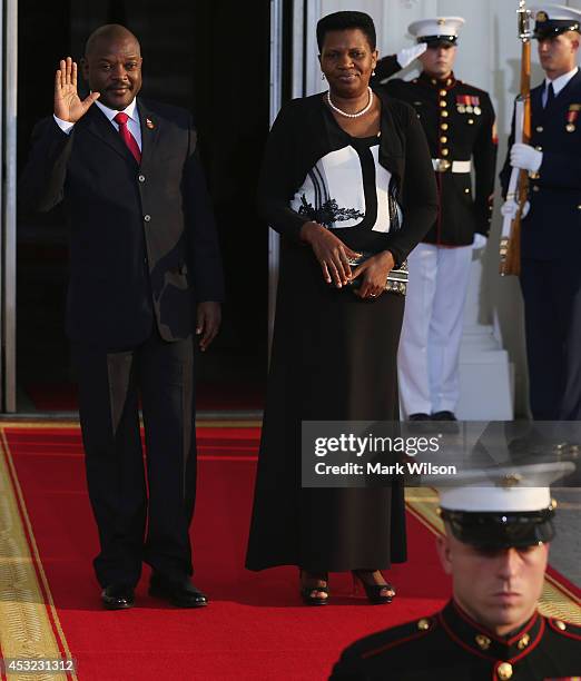 Burundi President Pierre Nkurunziza and spouse Denise Bucumi arrive at the North Portico of the White House for a State Dinner on the occasion of the...