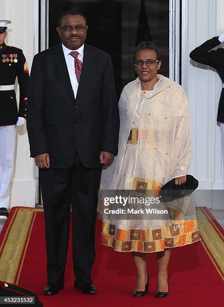 Ethiopia Prime Minister Hailemariam Desalegn Boshe and spouse Roman Tesfaye arrive at the North Portico of the White House for a State Dinner on the...