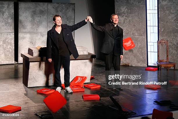 Actors Davy Sardou and Francis Huster during the traditional throw of cushions at the final of "L'Affrontement" play during the 30th Ramatuelle...