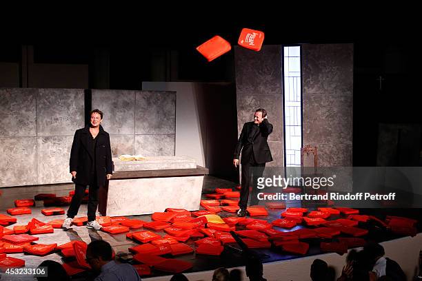 Actors Davy Sardou and Francis Huster during the traditional throw of cushions at the final of "L'Affrontement" play during the 30th Ramatuelle...