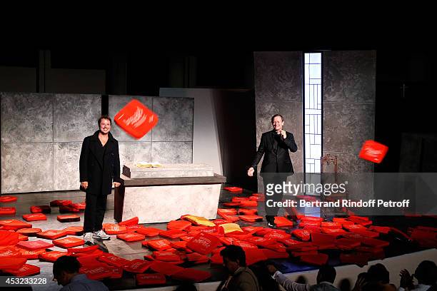 Actors Davy Sardou and Francis Huster during the traditional throw of cushions at the final of "L'Affrontement" play during the 30th Ramatuelle...
