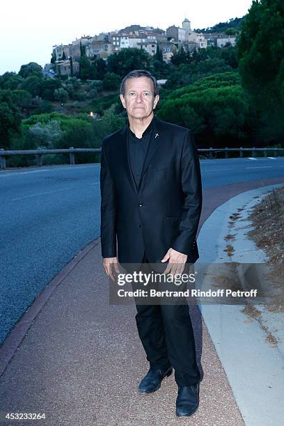 Actor Francis Huster poses in front of Ramatuelle during the 30th Ramatuelle Festival : Day 5 on August 5, 2014 in Ramatuelle, France.