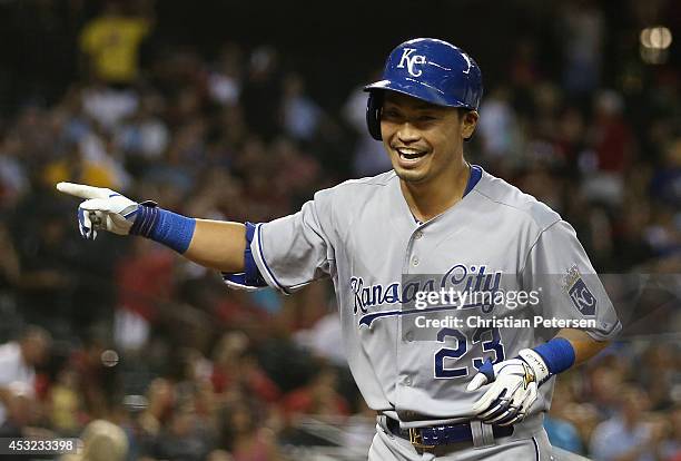 Norichika Aoki of the Kansas City Royals points to fans after hitting a grand slam against the Arizona Diamondbacks during the fifth inning of the...