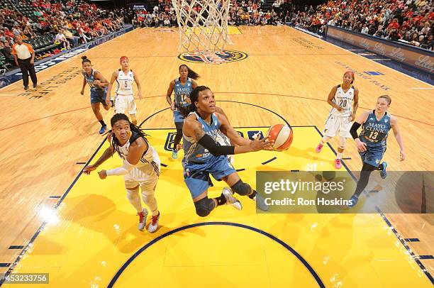 Tan White of the Minnesota Lynx drives to the basket against the Indiana Fever during the WNBA game on August 5, 2014 at Bankers Life Fieldhouse in...