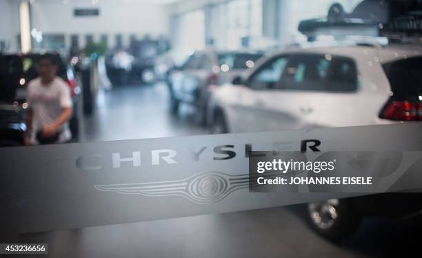Chrysler logo is pictured at a car dealership in Shanghai on August 6, 2014. German luxury car maker Audi and Chrysler of the United States have...