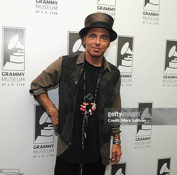Musician Nils Lofgren poses before An Evening With Nils Lofgren at The GRAMMY Museum on August 5, 2014 in Los Angeles, California.