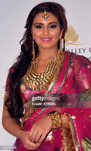 Indian Bollywood actress Huma Qureshi showcases a creation by designer Ashima Leena during the Aamby Valley India Bridal Fashion Week 2013 in Mumbai...