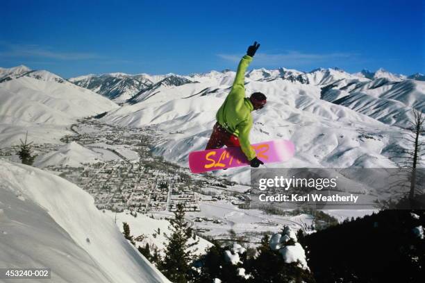 snowboarder in action above sun valley, idaho, usa (enhancement) - sun valley idaho stock pictures, royalty-free photos & images