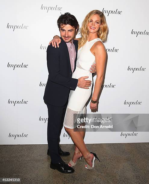 Felix Bloxsom and Erin Heatherton pose for a luxury fragrance launch at Angel & Ash on August 6, 2014 in Sydney, Australia.