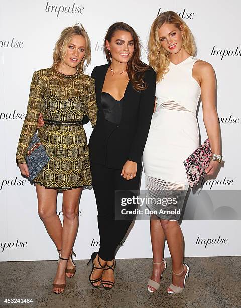 Zippora Seven, Bambi Northwood Blyth and Erin Heatherton pose for a luxury fragrance launch at Angel & Ash on August 6, 2014 in Sydney, Australia.